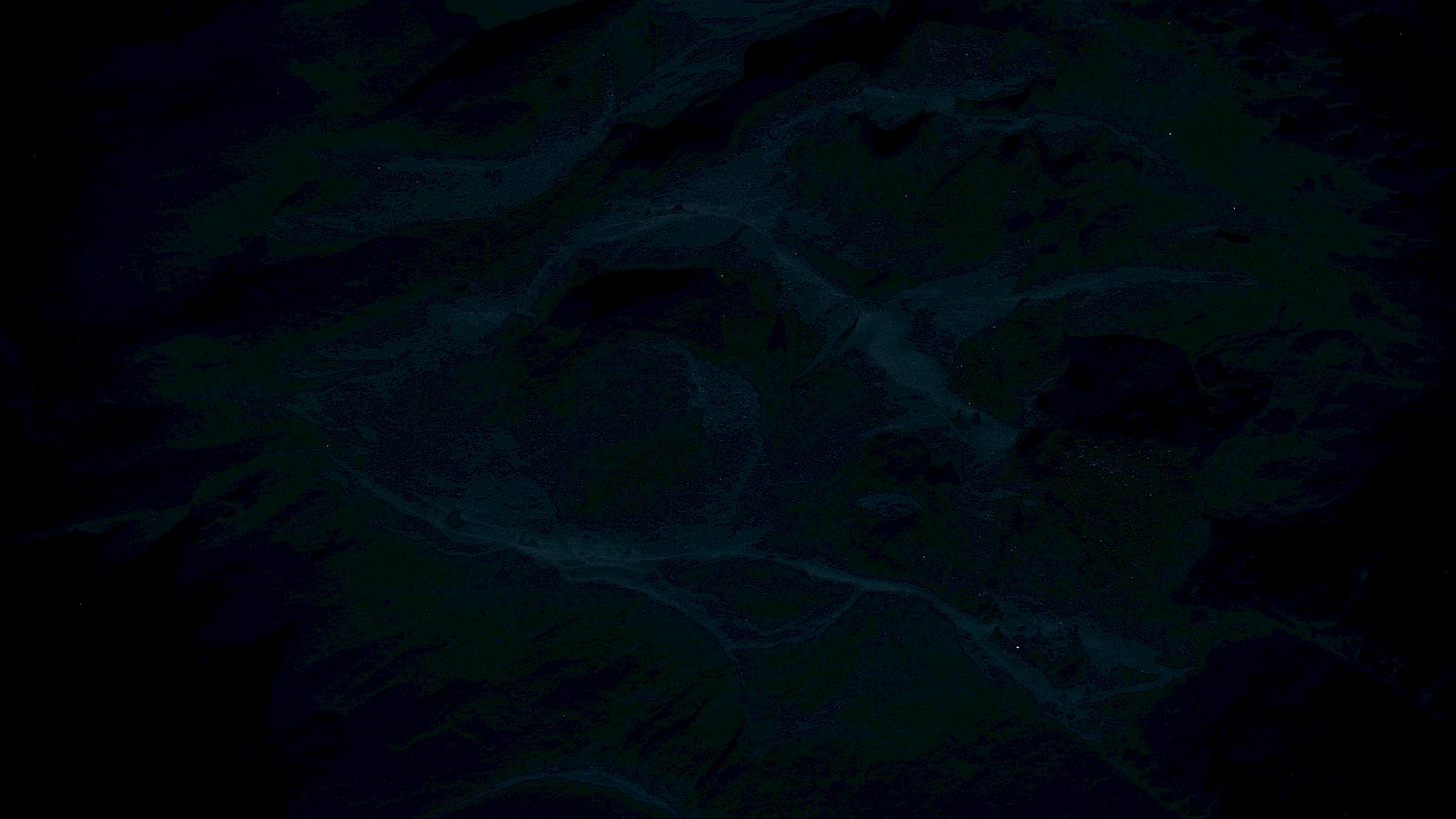 This image is very dark and difficult to discern details, possibly showing an abstract or low-light scene.